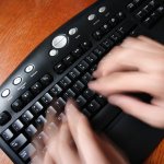 Fingers typing on keyboard icon